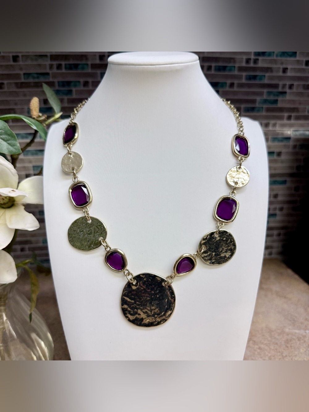 Chico’s purple and gold tone hammered disc necklace.